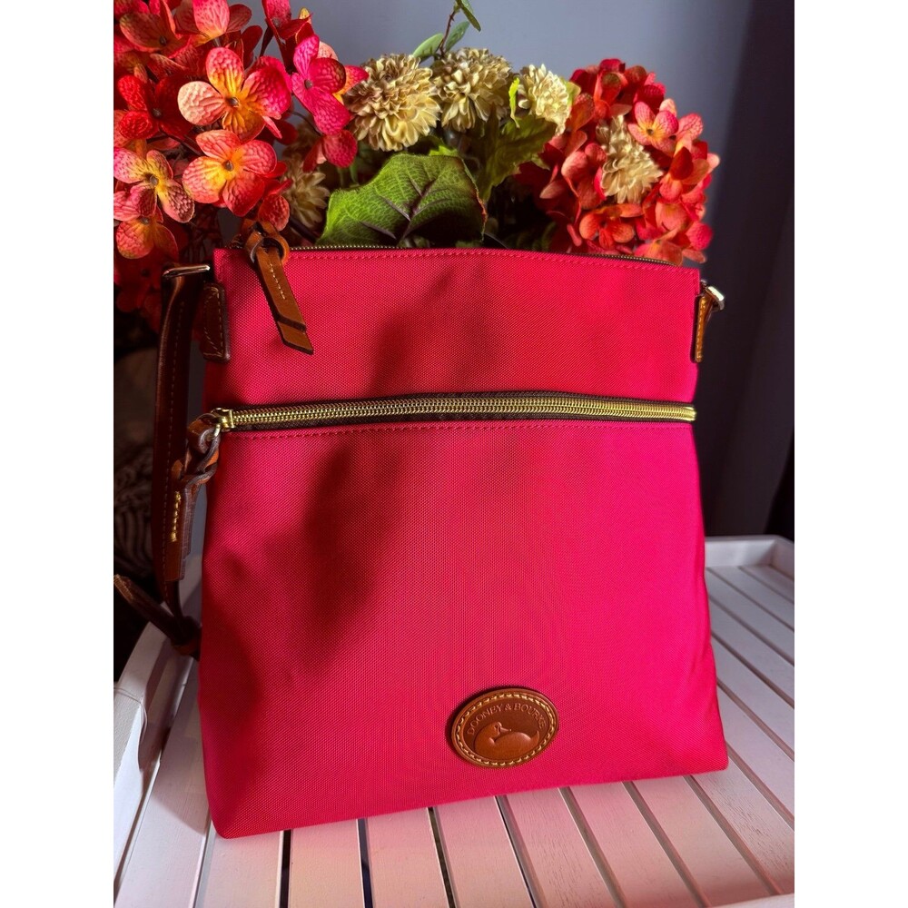 Genuine Dooney and Bourke Zip Crossbody Bag in Hot Pink  MSRP $218.00 like new